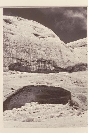 Caves west of Schock Trail, near Mile 111, North Bank.  Upper cave contains big slab with early inscriptions