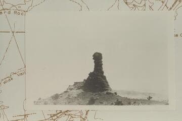 Chimney Rock.  Elevation at top is 5697 ft.  In lower Moencopie Formation.  Note white horse at the foot.  The Rock also carries the confusing name, Candlestick Spire